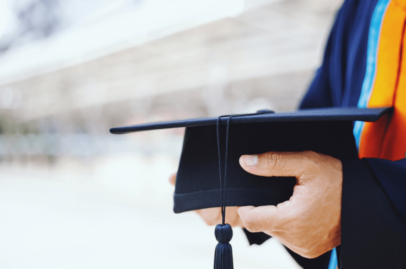 person holding graduation cap