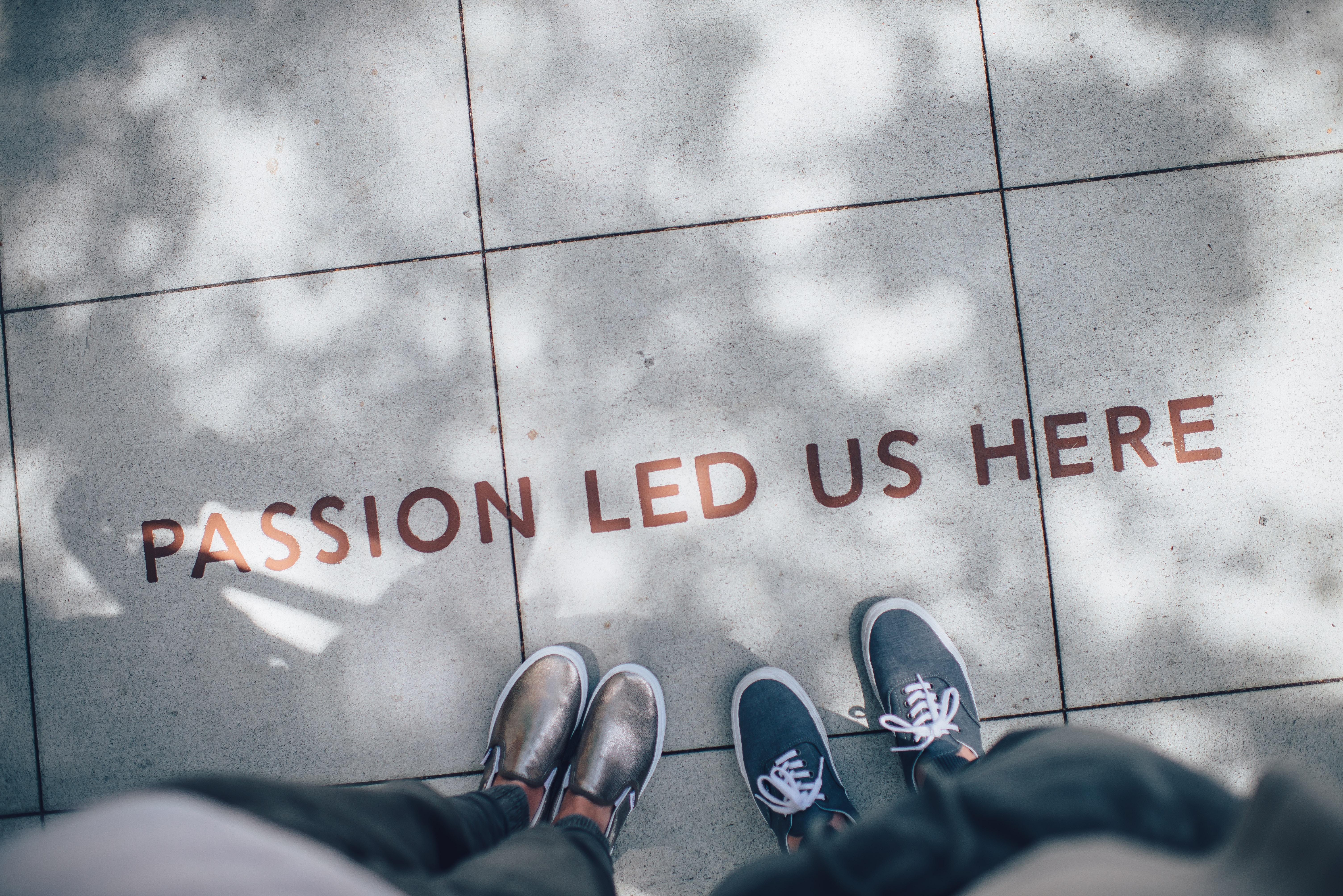 passion led us here written on sidewalk