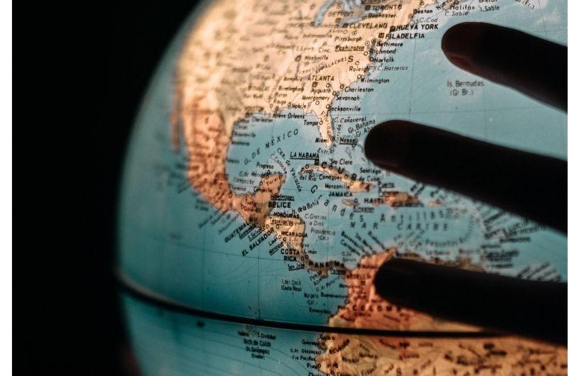 hand on globe
